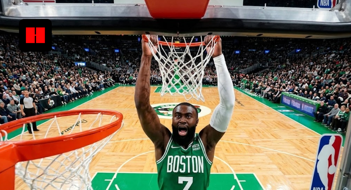 Boston Celtics guard Jaylen Brown performing a powerful two-handed slam dunk seen from a wide-angle backboard camera during an NBA game.