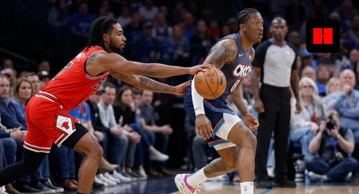 Jalen Williams of the Oklahoma City Thunder dribbling a basketball while being defended by Coby White of the Chicago Bulls during an NBA game.