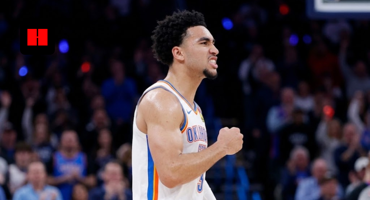 Philadelphia 76ers guard Jared McCain flexing and celebrating after a big play during an NBA game.