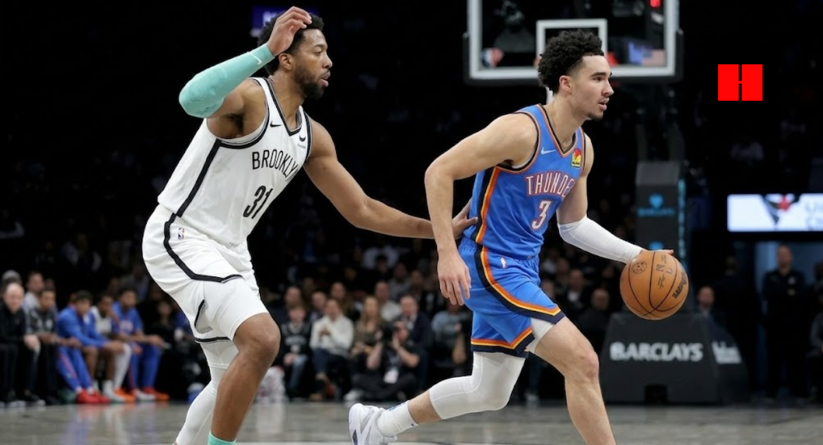 Oklahoma City Thunder guard Josh Giddey dribbling the basketball past Brooklyn Nets defender Noah Clowney during an NBA game at Barclays Center.