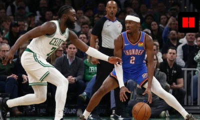 Oklahoma City Thunder’s Shai Gilgeous-Alexander (#2) maintains a low-gravity dribble while being closely guarded by Boston Celtics’ Jaylen Brown during a high-intensity NBA game.