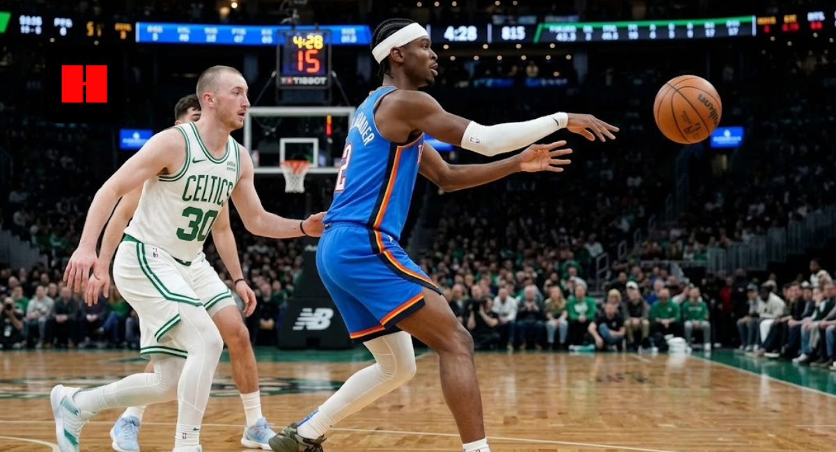 OKC Thunder guard Shai Gilgeous-Alexander wearing a blue jersey and white headband, throwing a pass while defended by Sam Hauser of the Boston Celtics.