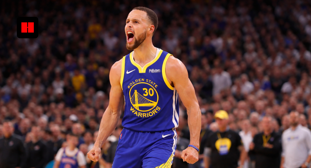 Stephen Curry roaring in Warriors uniform during high intensity NBA game action shot wide banner