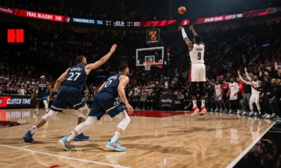 Jerami Grant hits a clutch corner three for the Portland Trail Blazers over Minnesota Timberwolves defenders in the final seconds of a 108–104 NBA game