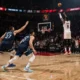 Jerami Grant hits a clutch corner three for the Portland Trail Blazers over Minnesota Timberwolves defenders in the final seconds of a 108–104 NBA game