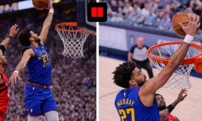 Denver Nuggets player jumping for a layup from an side angle while a defender contests near the rim during an NBA game