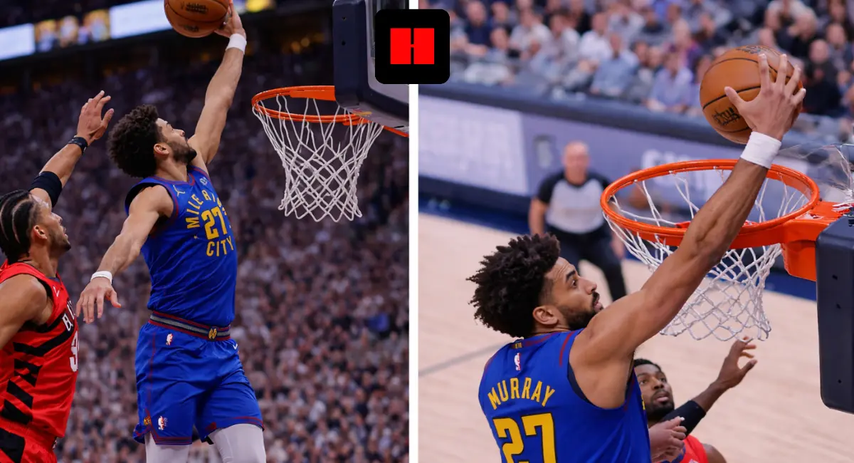 Denver Nuggets player jumping for a layup from an side angle while a defender contests near the rim during an NBA game
