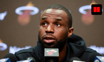 Andrew Wiggins speaks at Miami Heat press conference with microphones, discussing injury status before Lakers game