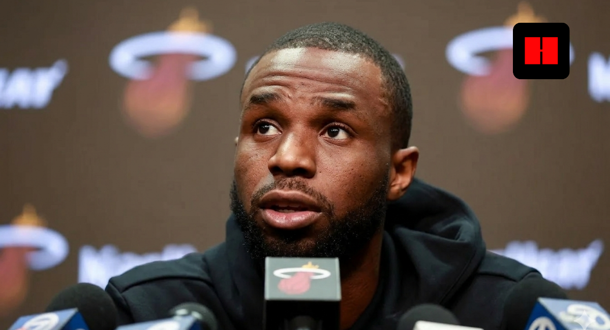 Andrew Wiggins speaks at Miami Heat press conference with microphones, discussing injury status before Lakers game