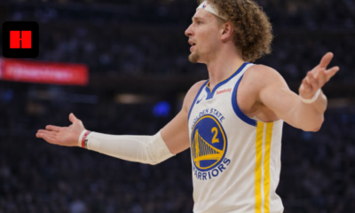 Brandin Podziemski of the Golden State Warriors reacting with arms out during an NBA game
