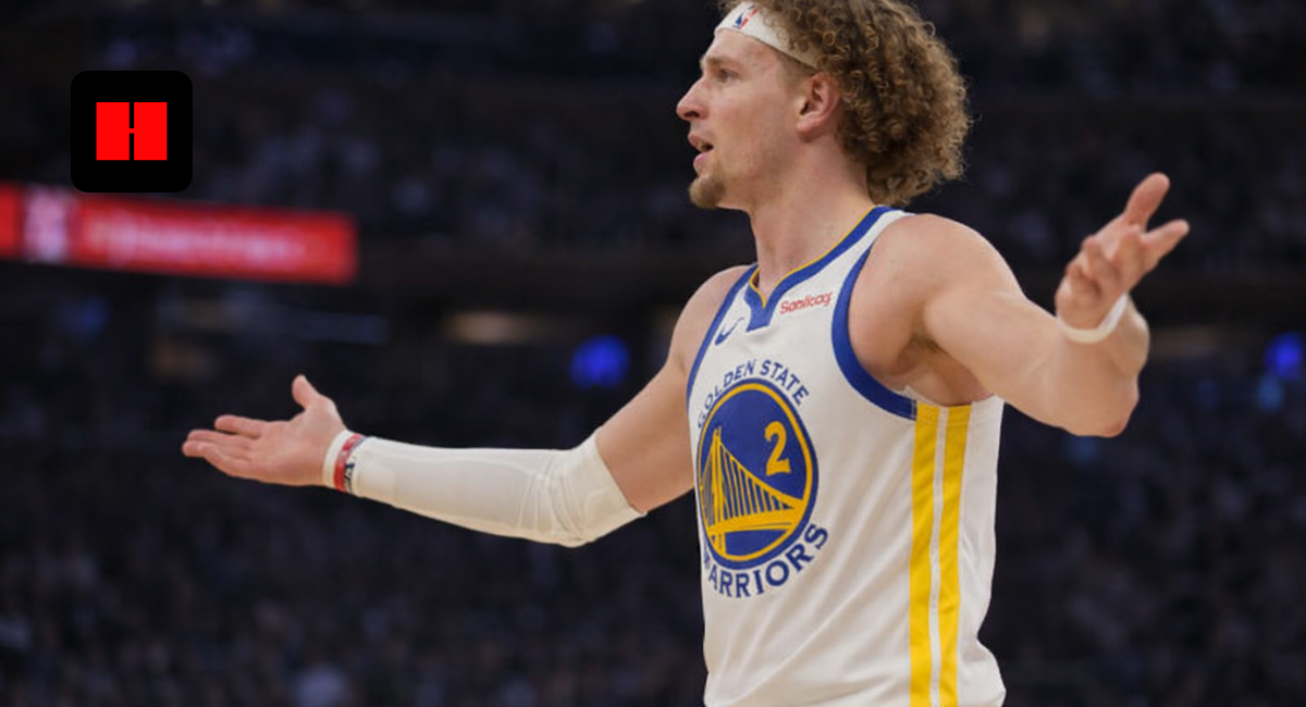 Brandin Podziemski of the Golden State Warriors reacting with arms out during an NBA game