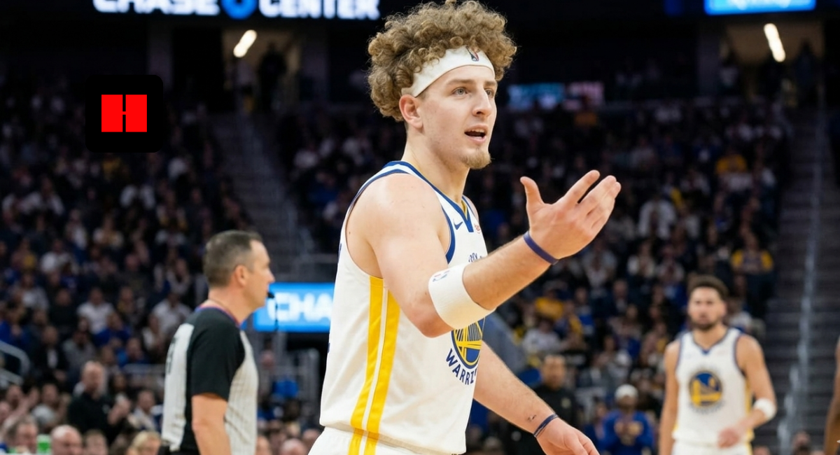 Brandin Podziemski of the Golden State Warriors standing on the court at Chase Center with his arm outstretched, looking toward a referee or teammate during a game.
