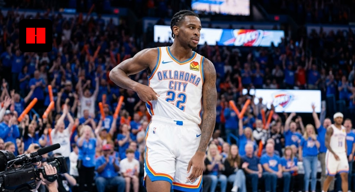 Oklahoma City Thunder guard Cason Wallace in jersey number 22 celebrating on court during a home game with fans cheering in the background.