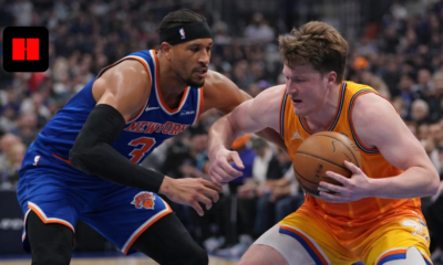 Charlotte Hornets player protecting the ball against New York Knicks defender during NBA game action