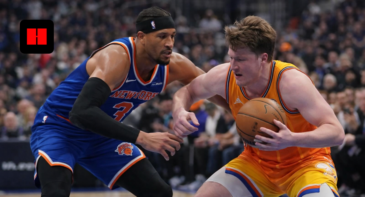 Charlotte Hornets player protecting the ball against New York Knicks defender during NBA game action