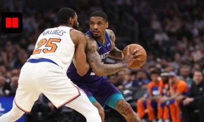 Charlotte Hornets player backing down New York Knicks defender during NBA basketball game action
