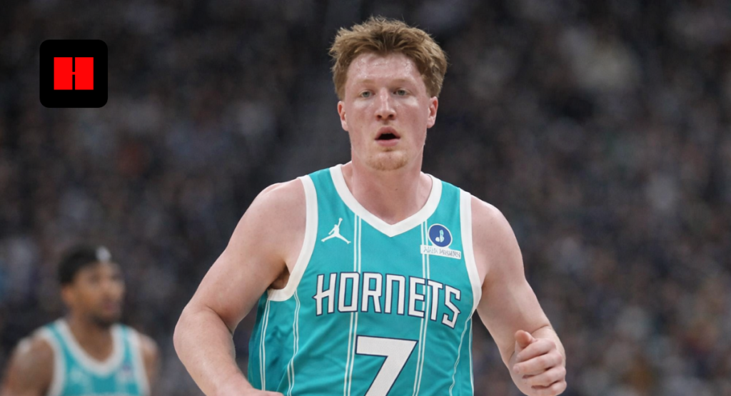 Charlotte Hornets player running up the court during NBA basketball game action