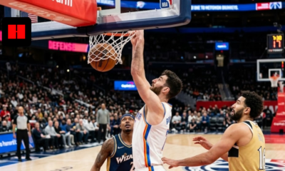 Chet Holmgren of the Oklahoma City Thunder performs a powerful one-handed dunk over Anthony Gill of the Washington Wizards during an NBA game.