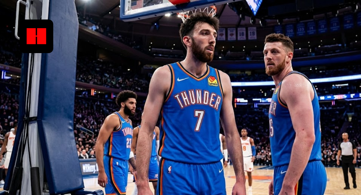 Chet Holmgren and Isaiah Hartenstein in Oklahoma City Thunder blue jerseys standing on a basketball court during an NBA game.