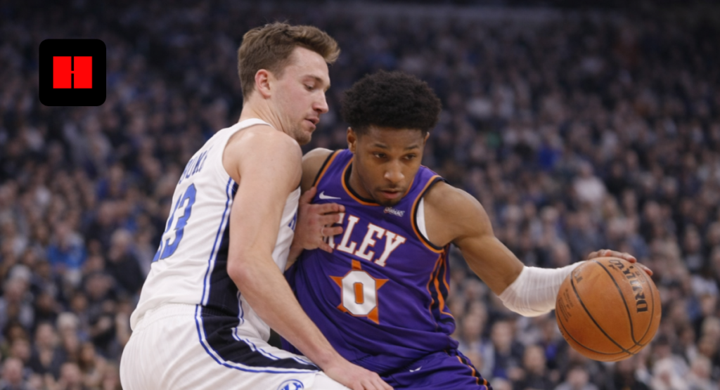 College basketball player driving to the basket while being defended closely during an intense game moment