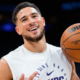 Devin Booker holding basketball during Phoenix Suns warmup in NBA arena UHD image