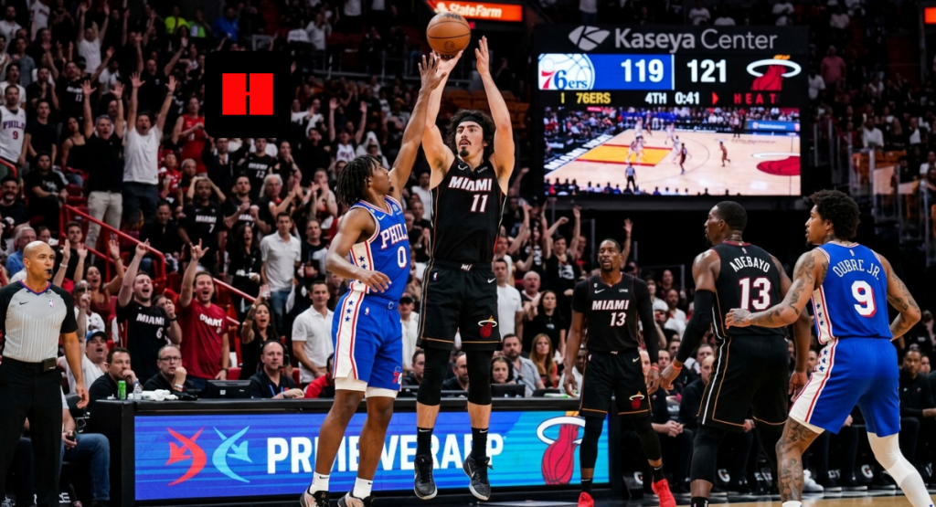 Miami Heat guard rises for a clutch jumper over Philadelphia 76ers defender late in the fourth quarter at Kaseya Center with crowd reacting in background