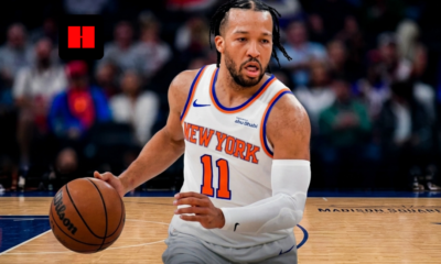 New York Knicks point guard Jalen Brunson (11) bringing the ball up the court at Madison Square Garden, wearing the home white Association Edition jersey with a focused expression during a 2026 regular season game.