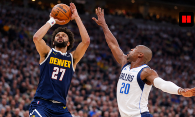 Jamal Murray takes a contested jump shot for the Denver Nuggets against Dallas Mavericks defender during NBA game