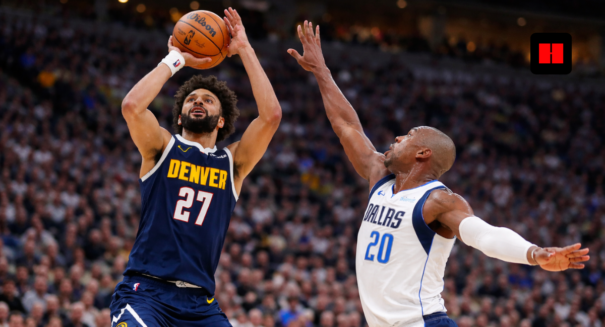Jamal Murray takes a contested jump shot for the Denver Nuggets against Dallas Mavericks defender during NBA game