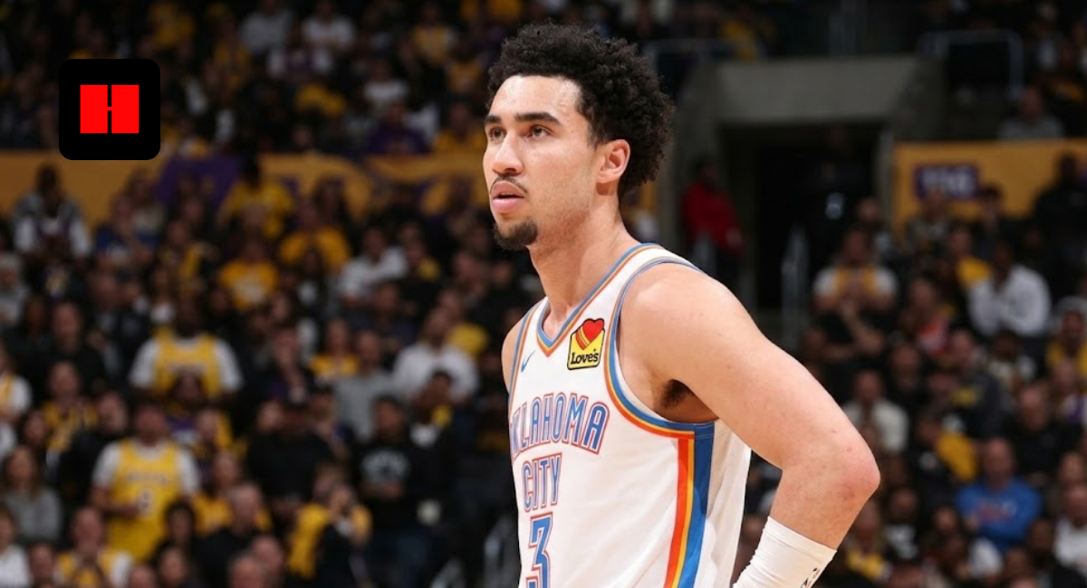 A close-up portrait photograph of Oklahoma City Thunder player Jared Mccain looking left during an NBA game, with his hand on his hip and a blurred crowd wearing yellow shirts in the background.