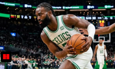 Jaylen Brown of the Boston Celtics driving to the basket during a game at TD Garden.