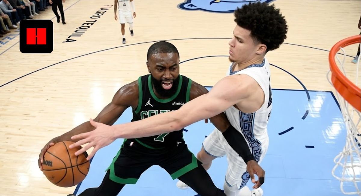 Jaylen Brown of the Boston Celtics driving to the basket against a Memphis Grizzlies defender during an NBA game.