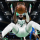 Jaylen Brown shooting a mid-range jumper over Cason Wallace during the Celtics vs. Thunder game at Paycom Center