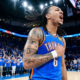 Oklahoma City Thunder forward Jaylin Williams shouting in celebration during a home game at Paycom Center.