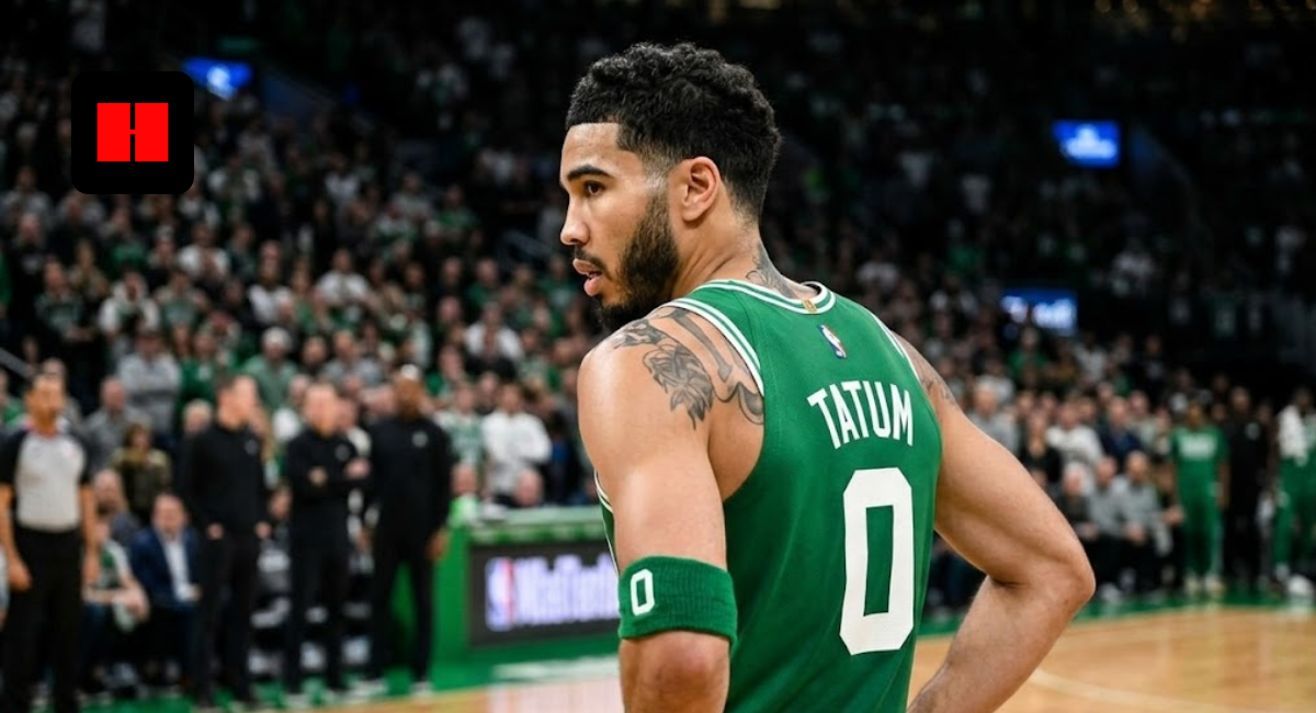Jayson Tatum in a green Boston Celtics jersey with number 0, viewed from a back-side angle on the basketball court.