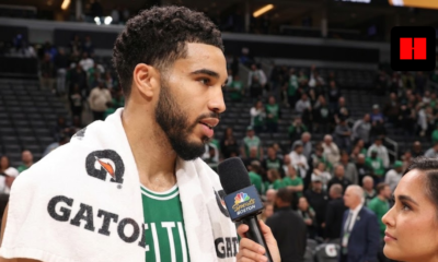 Boston Celtics forward Jayson Tatum wearing a Gatorade towel during a post-game sideline interview with an NBC Sports Boston reporter.