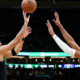 Boston Celtics forward Jayson Tatum shooting a jump shot over Washington Wizards defender Alex Sarr during an NBA game.
