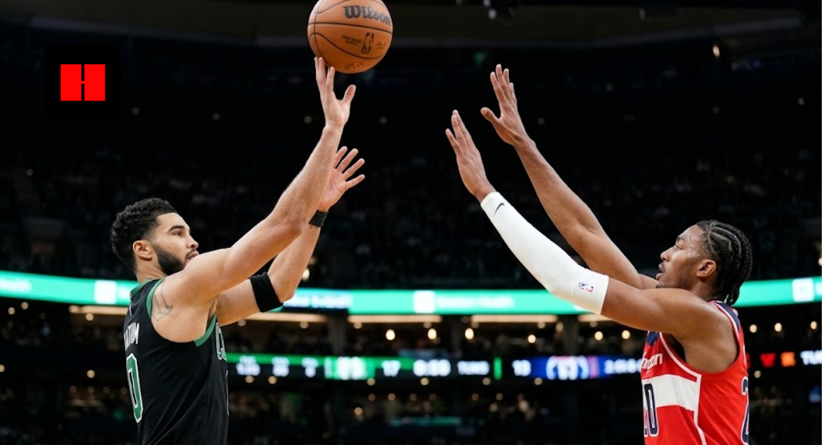 Boston Celtics forward Jayson Tatum shooting a jump shot over Washington Wizards defender Alex Sarr during an NBA game.