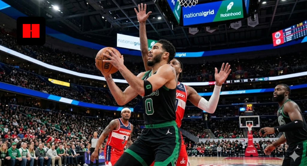 Boston Celtics forward Jayson Tatum driving to the basket for a layup against a Washington Wizards defender in a crowded NBA arena.