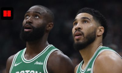 Jayson Tatum and Jaylen Brown of the Boston Celtics looking up during a game at TD Garden.