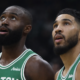 Jayson Tatum and Jaylen Brown of the Boston Celtics looking up during a game at TD Garden.