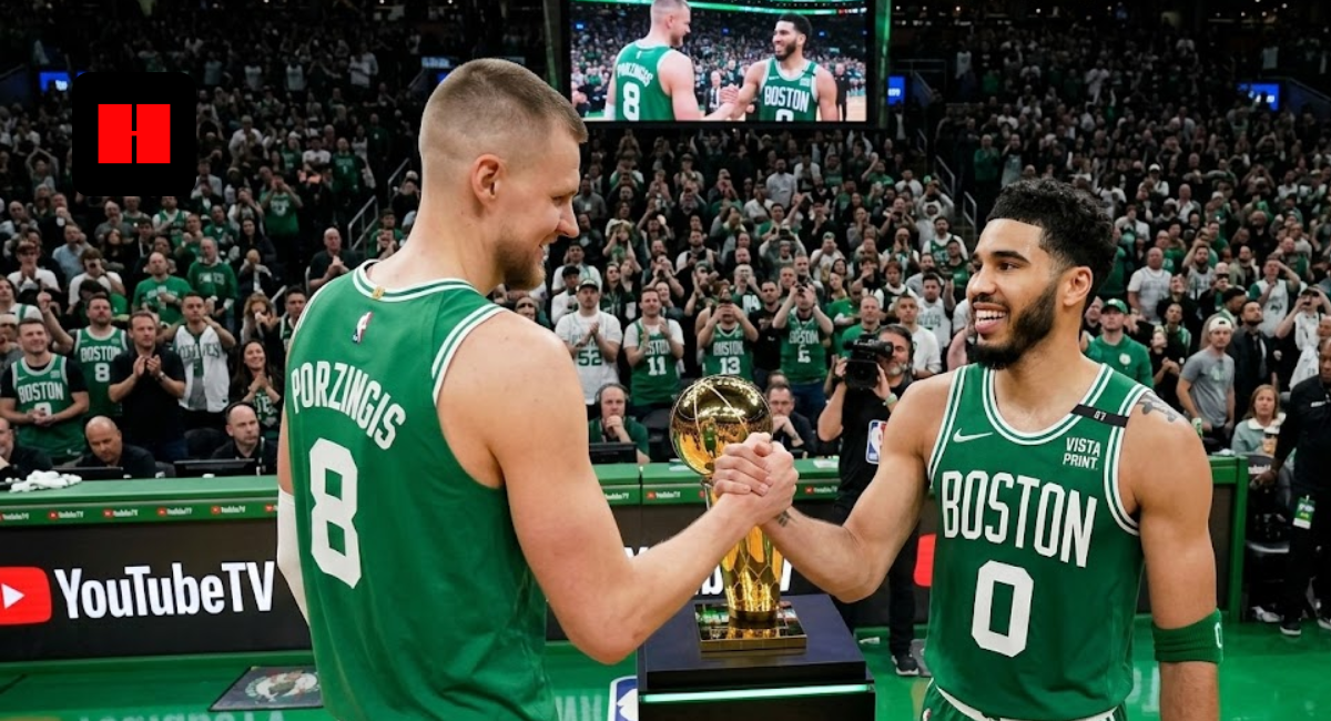 Jayson Tatum and Kristaps Porzingis shaking hands on the court in Boston Celtics green jerseys.