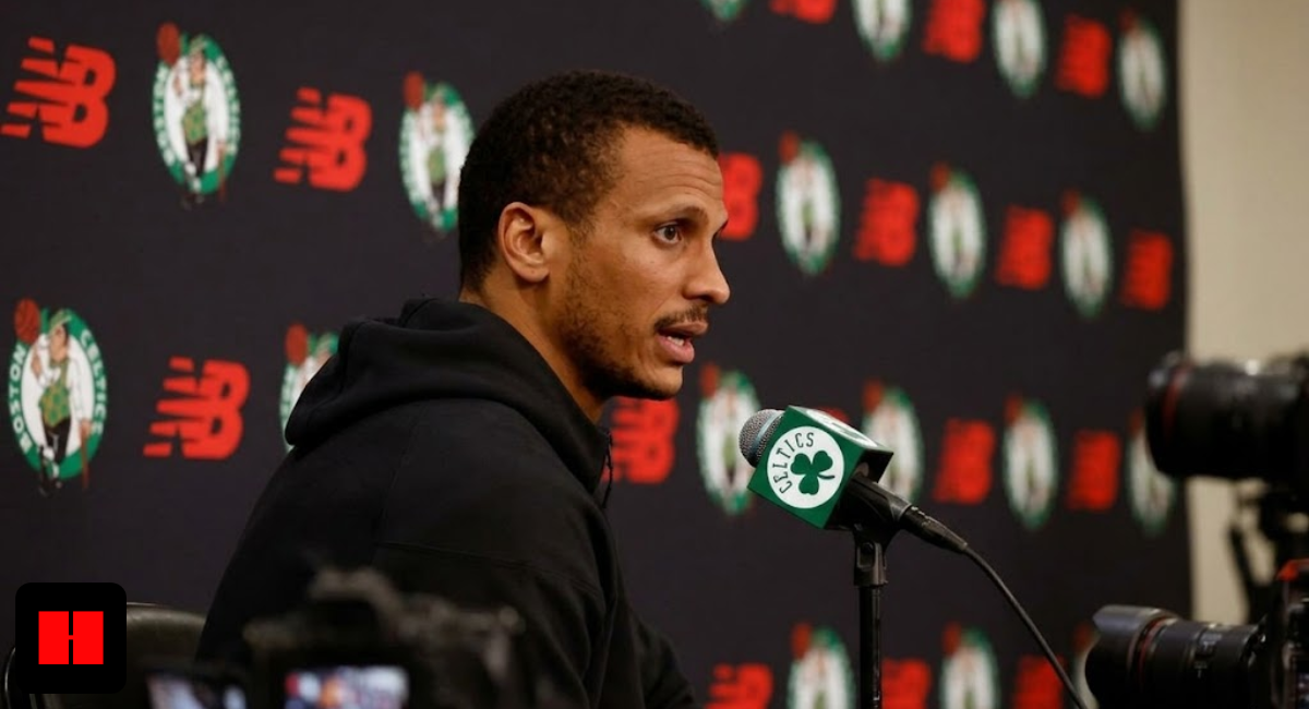 Boston Celtics head coach Joe Mazzulla speaking at a press conference podium with New Balance and team logos in the background.