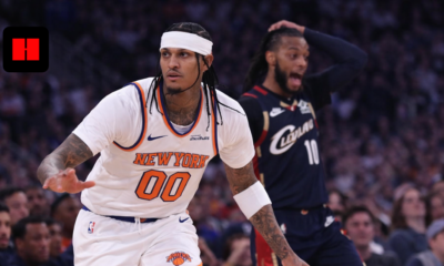 Jordan Clarkson of the New York Knicks pushes the ball in transition during a game against the Cleveland Cavaliers as a defender reacts in the background.
