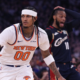 Jordan Clarkson of the New York Knicks pushes the ball in transition during a game against the Cleveland Cavaliers as a defender reacts in the background.