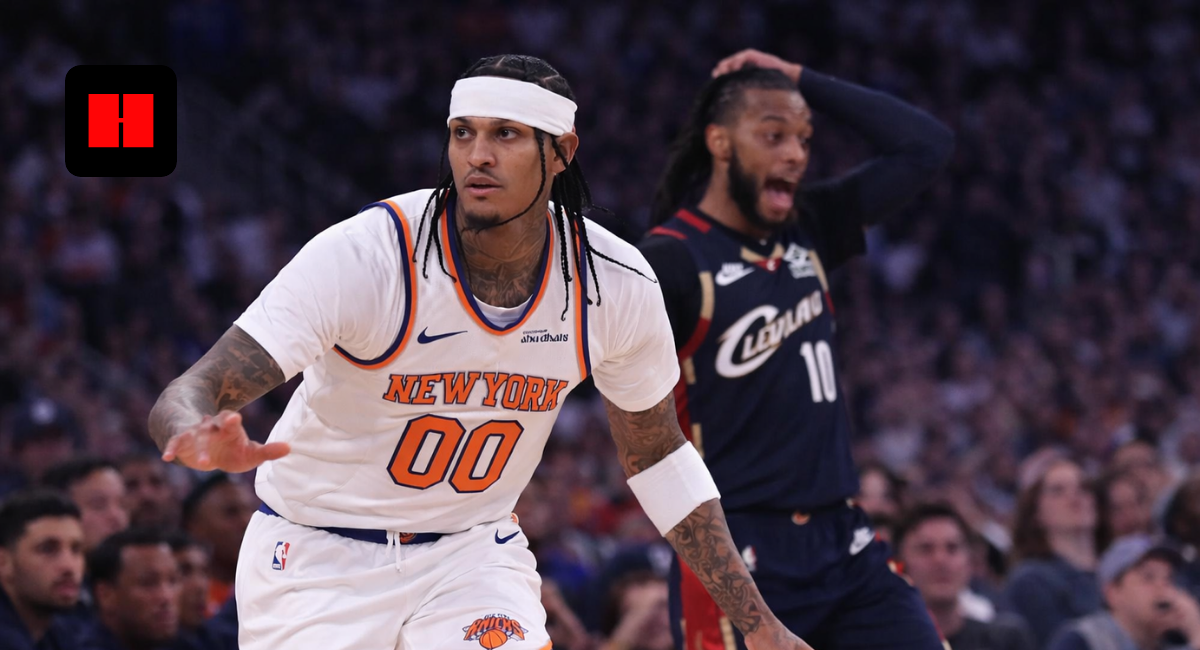 Jordan Clarkson of the New York Knicks pushes the ball in transition during a game against the Cleveland Cavaliers as a defender reacts in the background.
