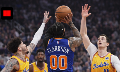 Jordan Clarkson taking a contested shot against Charlotte Hornets defenders during New York Knicks NBA game