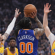 Jordan Clarkson taking a contested shot against Charlotte Hornets defenders during New York Knicks NBA game