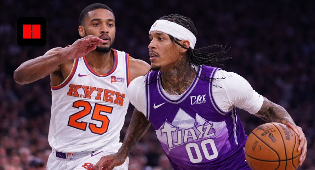 Jordan Clarkson of the Utah Jazz drives to the basket while a New York Knicks defender contests during an NBA game.