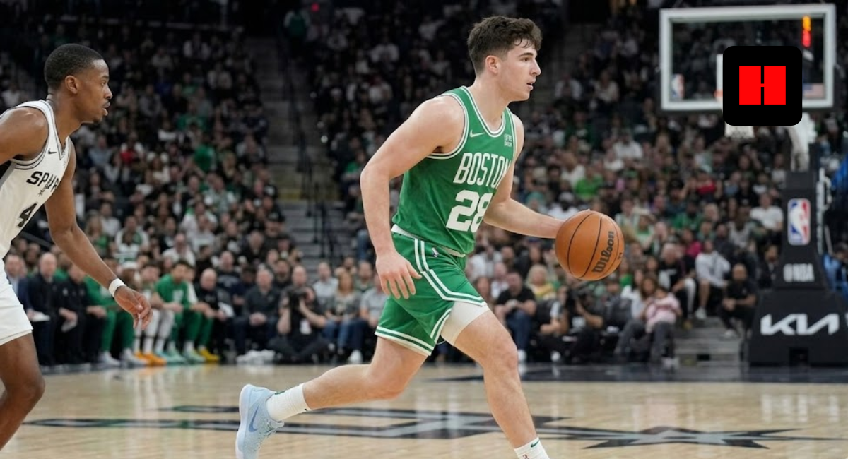 Boston Celtics player Jordan Walsh dribbling the basketball during an NBA game against the San Antonio Spurs.
